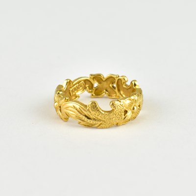 Lot 746 - A 14ct gold Hawaiian wedding band with cut-out...