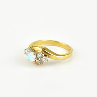 Lot 749 - A 9ct diamond and opal cluster ring, size P,...