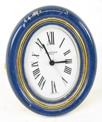 Lot 159 - CARTIER; a gilt metal and lapis lazuli effect...