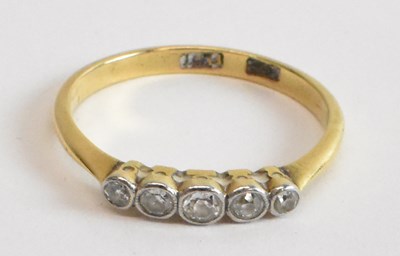 Lot 806 - An 18ct yellow gold and platinum five stone...