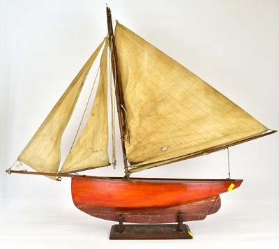 Lot 222 - An early 20th century three-sail pond yacht on...