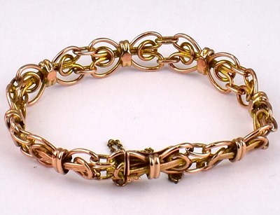 Lot 802 - A 9ct rose gold fancy link bracelet in the...