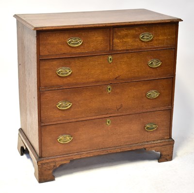 Lot 2 - A Georgian oak chest of two short over three...