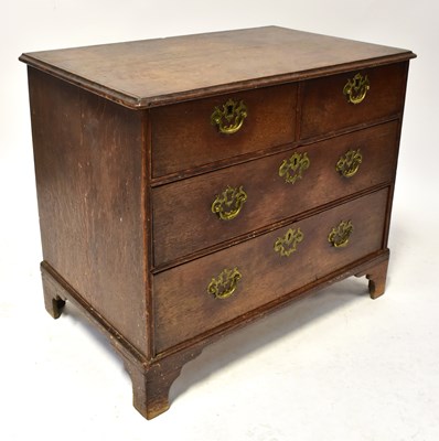 Lot 1 - A Georgian oak chest of two short over two...