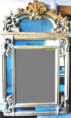 Lot 51 - A reproduction overmantel mirror in the Rococo...