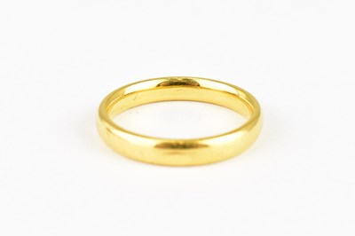 Lot 715 - A 22ct gold wedding band, size K, approx. 3.8g.