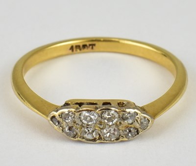 Lot 733 - An 18ct gold diamond cluster ring, size S,...