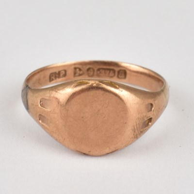 Lot 775 - A 9ct rose gold signet ring with blank table,...