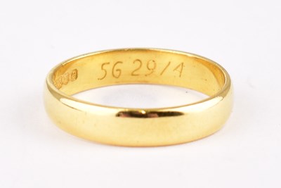 Lot 714 - A 22ct (marked 916) gold wedding band, size P,...