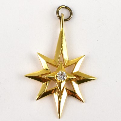 Lot 833 - A 14ct gold star pendant with small centred...