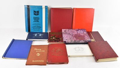 Lot 405 - A group of twelve albums of all world stamps...