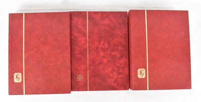 Lot 408 - A group of three thirty-two page stock books...