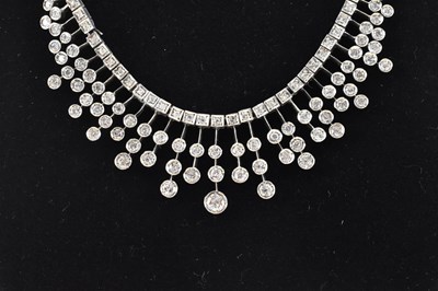 Lot 774 - A white metal Art Deco style frilled diamond...