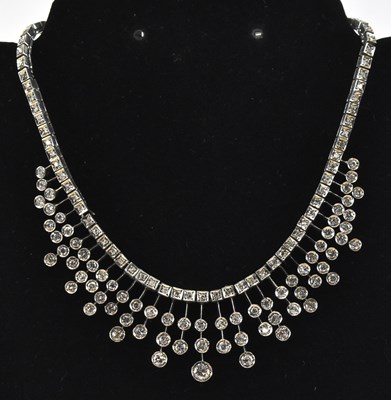 Lot 774 - A white metal Art Deco style frilled diamond...