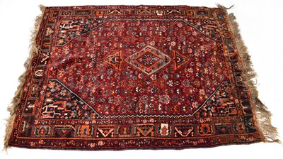 Lot 127 - An Iranian Kashgai hand-knotted rug, with dark...