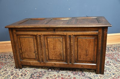 Lot 279 - An 18th century oak coffer with fielded panels...