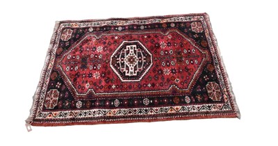 Lot 358 - An Eastern style rug with stylised decoration,...