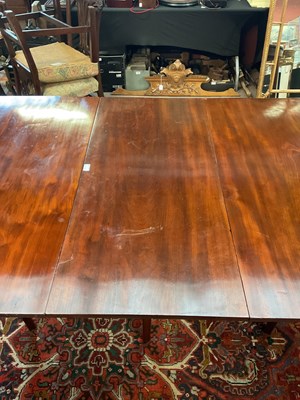 Lot 5 - A Georgian mahogany D-end dining table with...