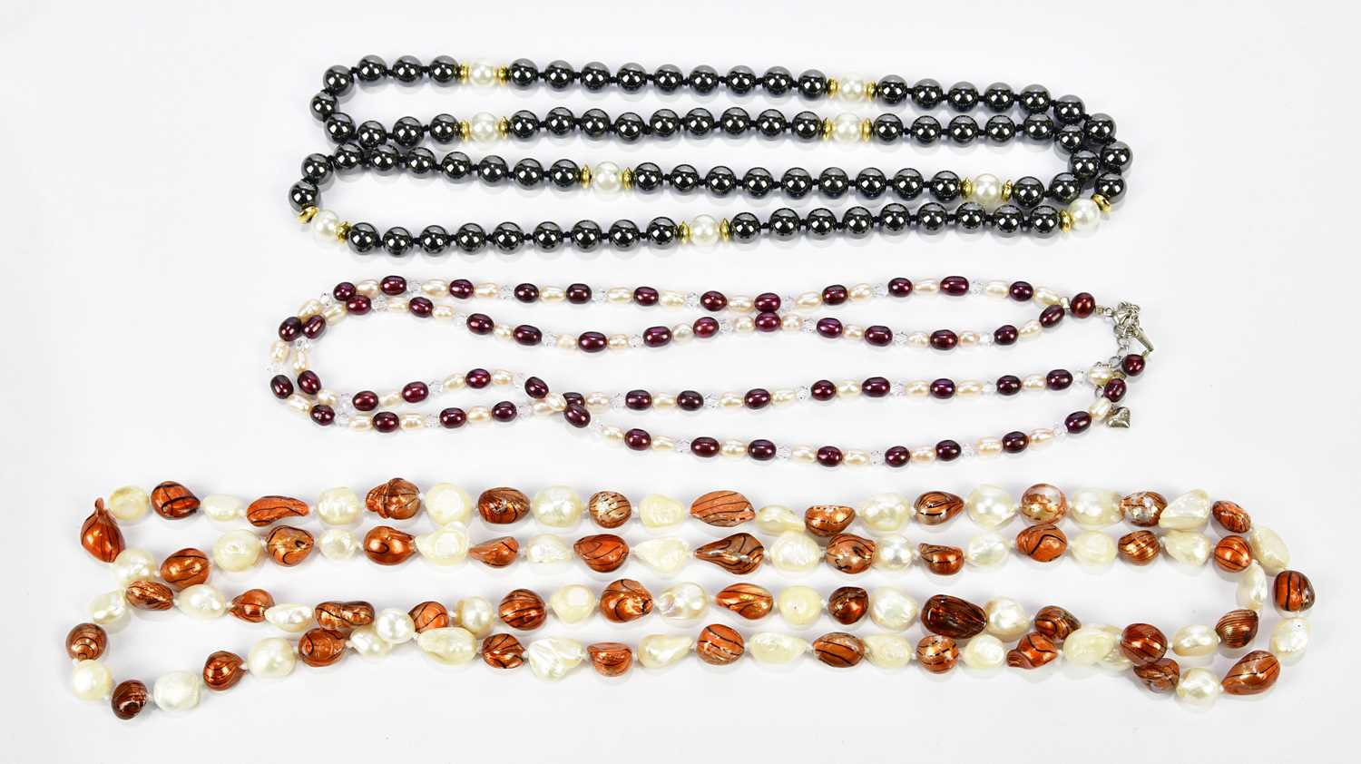 Lot 531 - A double strand natural pearl necklace and two...