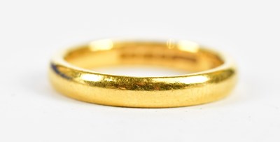 Lot 122 - A 22ct yellow gold wedding band, size N,...