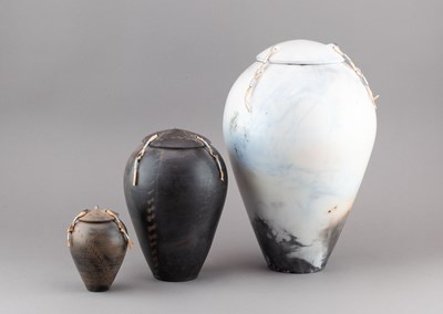 Lot 133 - DAVID OXLEY; a graduated trio of raku jars and...