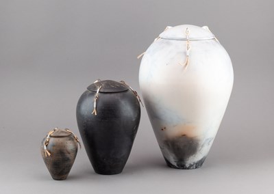 Lot 133 - DAVID OXLEY; a graduated trio of raku jars and...