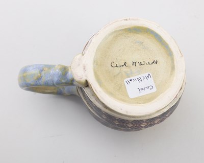 Lot 61 - CAROL McNICOLL (born 1943); an earthenware mug...