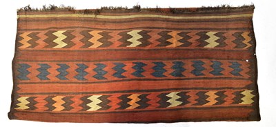 Lot 119 - A hand-woven Beluch Kilim muted tan, blue and...