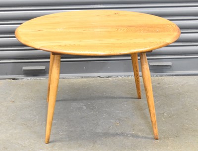 Lot 80 - A mid century light oak oval coffee table,...
