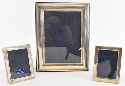 Lot 737 - A group of three hallmarked silver photograph...