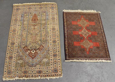 Lot 120 - A cream ground Persian style rug with...