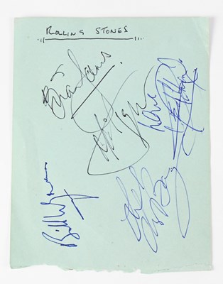 Lot 562 - THE ROLLING STONES; a torn page from an...