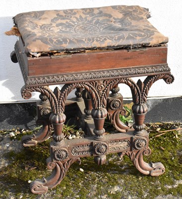 Lot 98 - A 19th century heavily carved oak piano stool...