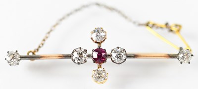 Lot 825 - A yellow metal bar brooch set with diamonds...