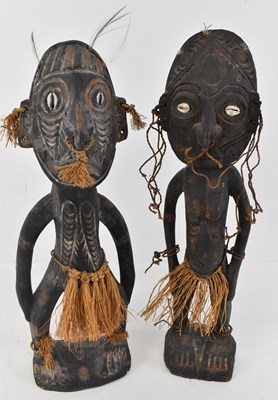 Lot 585 - A pair of African ancestoral figures, male and...