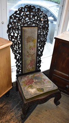 Lot 1218 - A 19th century carved prayer chair with...