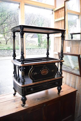 Lot 1219 - A Victorian walnut and ebonised Canterbury...