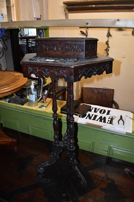 Lot 1258 - An early 20th century carved oak writing table,...