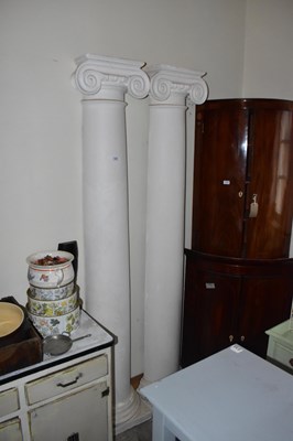 Lot 1269 - A pair of composite Ionic columns, height 310cm.