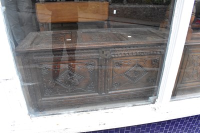 Lot 1288 - An 18th century carved and panelled oak coffer,...