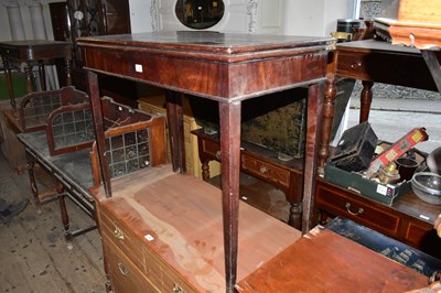 Lot 1305 - A Georgian mahogany fold-over tea table on...