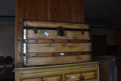 Lot 1321 - A metal bound pine dome top travelling trunk,...