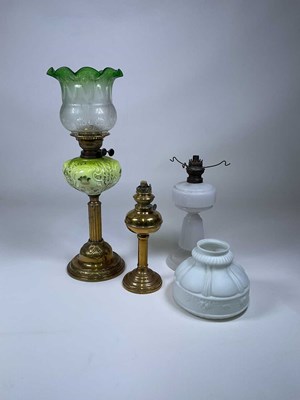 Lot 582 - A Victorian brass oil lamp with green tinted...