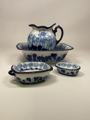 Lot 185 - An Art Nouveau inspired blue and white pottery...