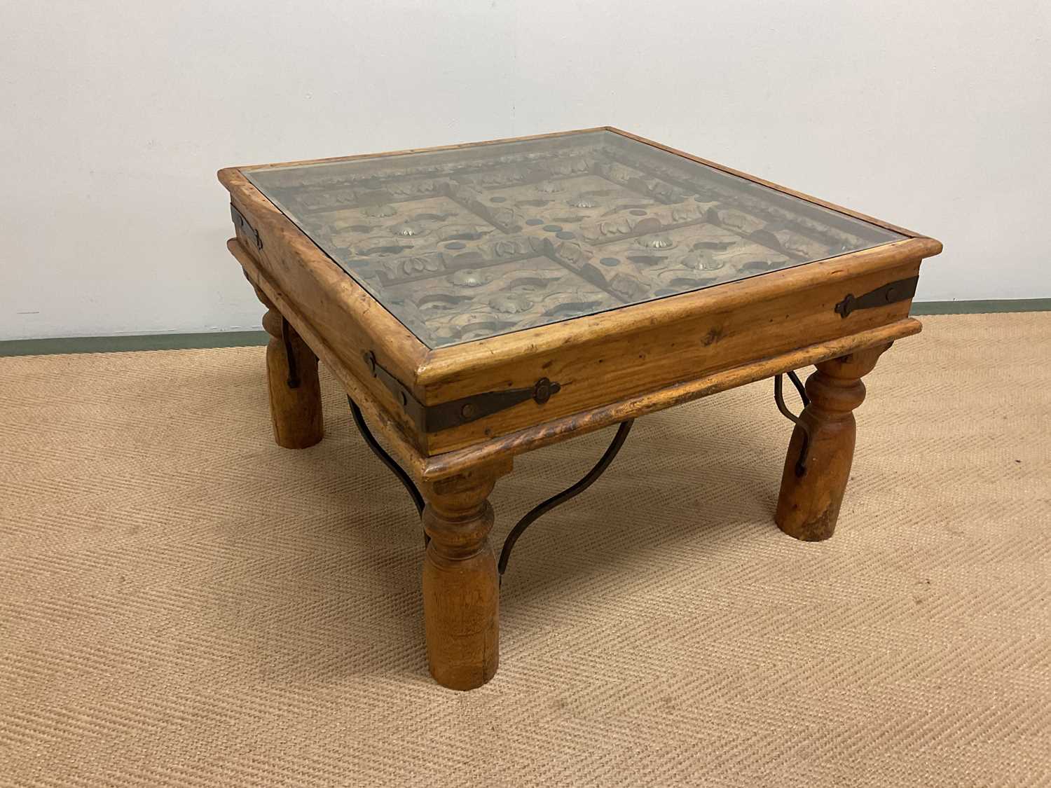 Lot 684 - A North African hardwood table fashioned from...