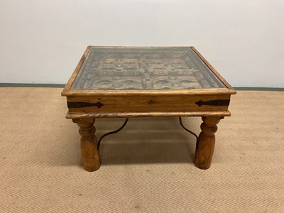 Lot 684 - A North African hardwood table fashioned from...