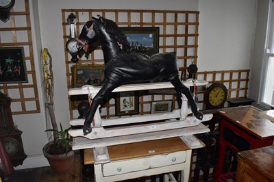 Lot 1357 - A vintage rocking horse, upholstered in a...