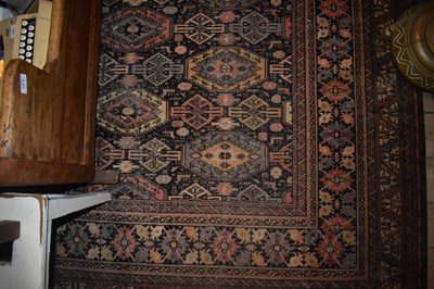 Lot 1473 - A large Eastern style rug with stylised...