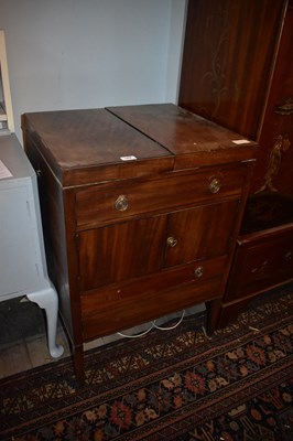 Lot 1486 - A Georgian mahogany washstand, the two hinged...