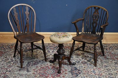 Lot 129 - A Victorian carved rosewood piano stool with...